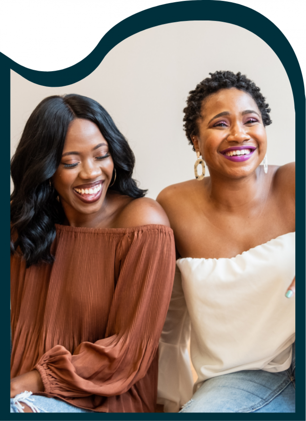 two women smiling and laughing