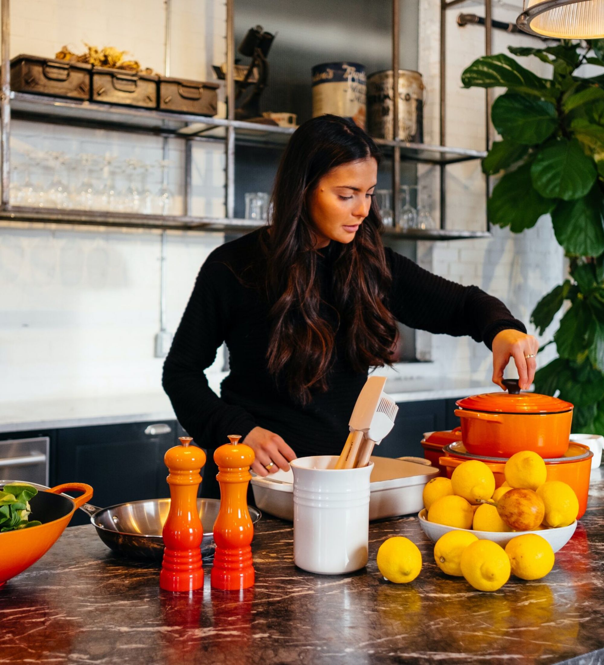 woman making a meal in her luxury studio apartment